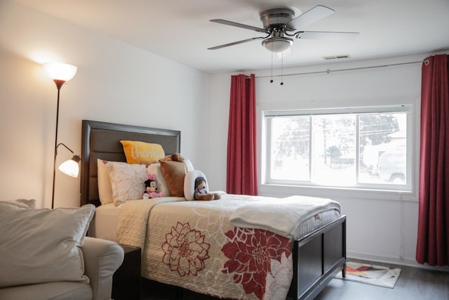 bedroom with visible vents, a ceiling fan, and baseboards