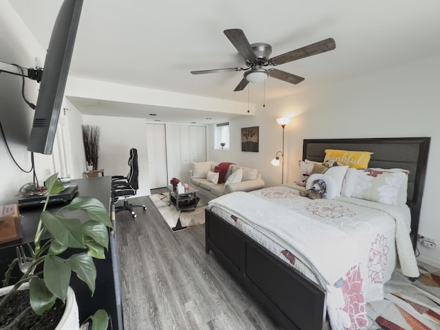 bedroom with a ceiling fan and wood finished floors