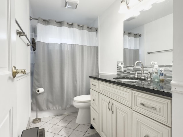 bathroom featuring vanity, visible vents, and toilet