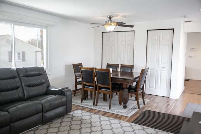 dining room featuring ceiling fan and wood finished floors