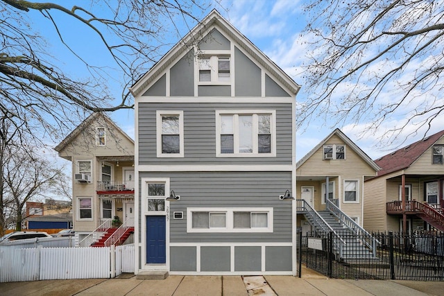2957 N Avers Ave, Chicago, IL 60618 - view of front of property featuring stairs, a fenced front yard, and cooling unit