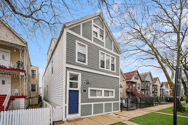 2957 N Avers Ave, Chicago, IL 60618 - view of front of home with a residential view and fence