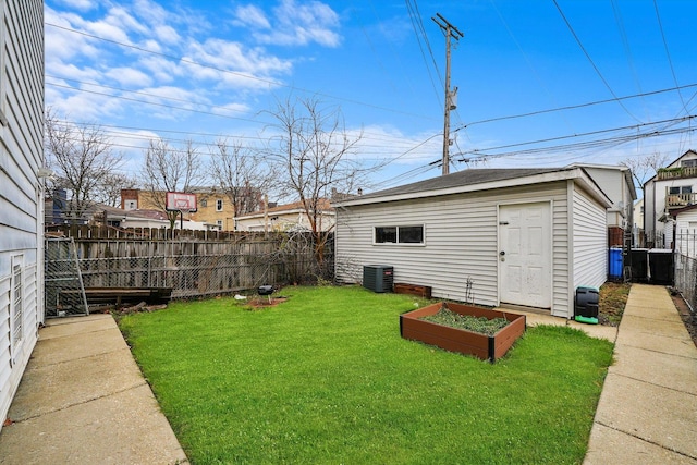 2957 N Avers Ave, Chicago, IL 60618 - view of yard with cooling unit, a vegetable garden, and an outbuilding