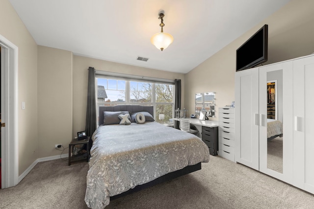 bedroom with baseboards, visible vents, light carpet, and vaulted ceiling