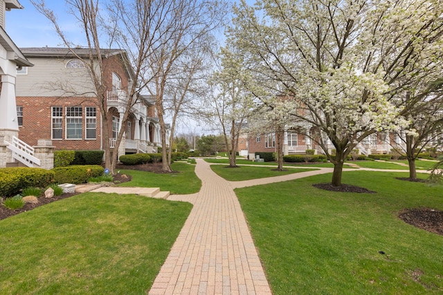 view of home's community featuring a lawn