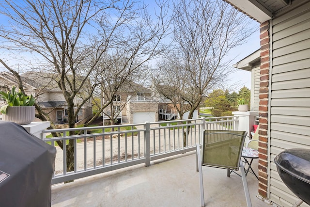 balcony featuring grilling area and a residential view