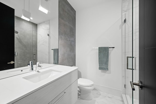 full bath featuring baseboards, vanity, toilet, marble finish floor, and a marble finish shower