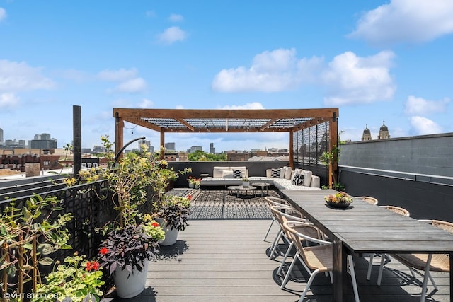 deck with a city view, a pergola, and outdoor lounge area