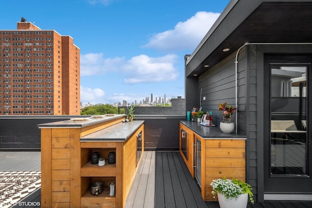 wooden terrace featuring a view of city