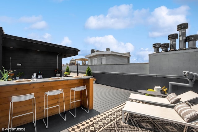 view of patio / terrace with a deck and outdoor dry bar