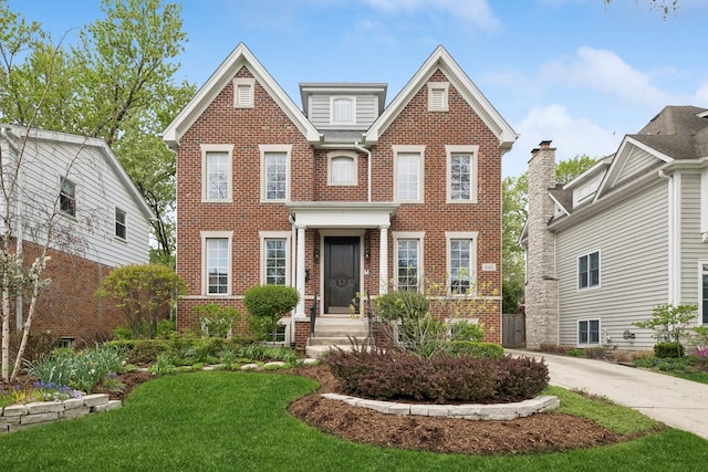 840 S Madison St, Hinsdale, IL 60521 - colonial home featuring brick siding, a front yard, and entry steps