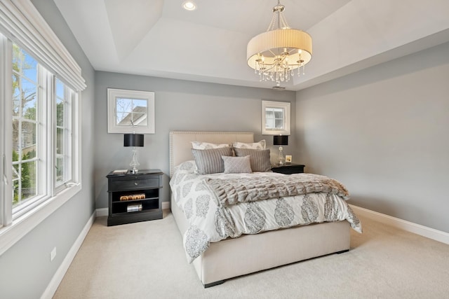 840 S Madison St, Hinsdale, IL 60521 - carpeted bedroom featuring a raised ceiling, baseboards, and a chandelier