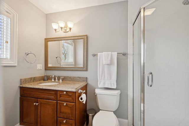 840 S Madison St, Hinsdale, IL 60521 - bathroom featuring a stall shower, vanity, toilet, and a chandelier