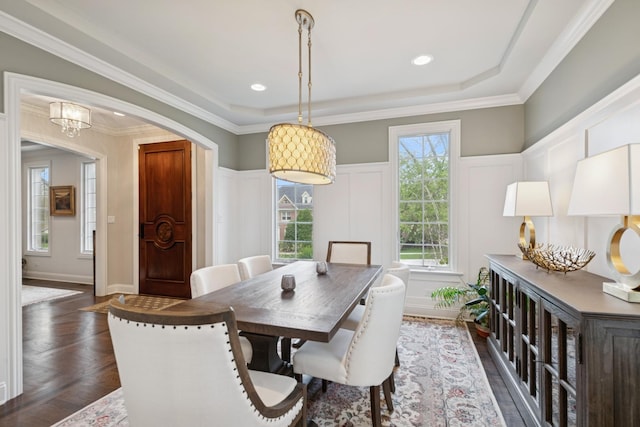 840 S Madison St, Hinsdale, IL 60521 - dining space with a decorative wall, arched walkways, a wainscoted wall, crown molding, and dark wood-style flooring