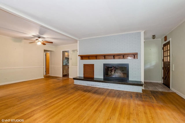 10740 S Drew St, Chicago, IL 60643 - unfurnished living room with crown molding, wood finished floors, a fireplace, and ceiling fan