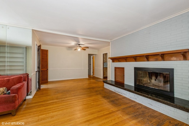 10740 S Drew St, Chicago, IL 60643 - living room with wood finished floors, a brick fireplace, ornamental molding, ceiling fan, and built in features