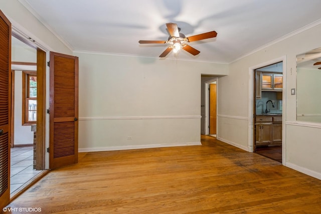 10740 S Drew St, Chicago, IL 60643 - empty room with a ceiling fan, wood finished floors, and ornamental molding