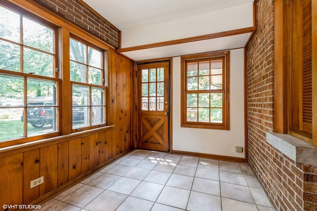 10740 S Drew St, Chicago, IL 60643 - entryway with healthy amount of natural light, brick wall, light tile patterned floors, and wooden walls