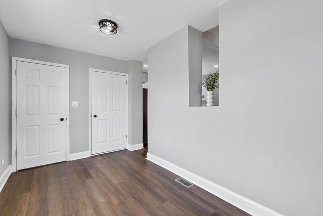 5068 W Congress Pkwy, Chicago, IL 60644 - unfurnished bedroom featuring baseboards and wood finished floors