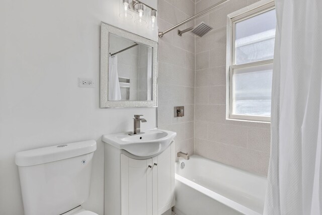 5068 W Congress Pkwy, Chicago, IL 60644 - full bathroom with plenty of natural light, toilet, vanity, and shower / bathtub combination with curtain