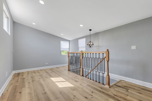 5068 W Congress Pkwy, Chicago, IL 60644 - stairway featuring a chandelier, wood finished floors, baseboards, recessed lighting, and lofted ceiling