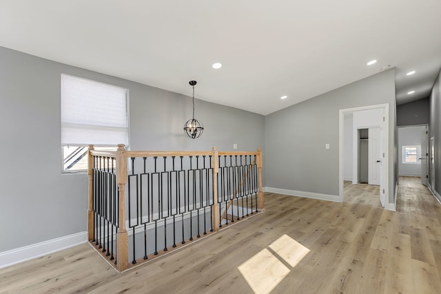 5068 W Congress Pkwy, Chicago, IL 60644 - hallway featuring an upstairs landing, a chandelier, wood finished floors, lofted ceiling, and recessed lighting