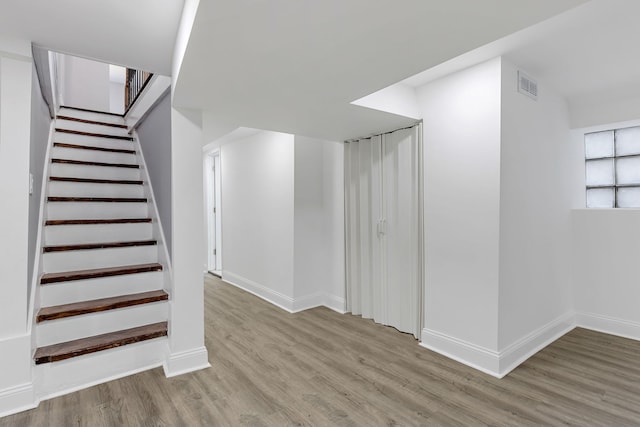 5068 W Congress Pkwy, Chicago, IL 60644 - staircase featuring wood finished floors and baseboards