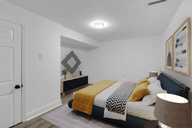 5068 W Congress Pkwy, Chicago, IL 60644 - bedroom featuring wood finished floors and baseboards