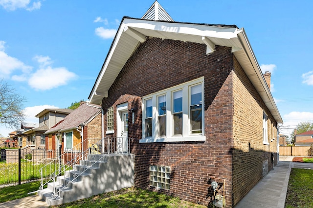 5068 W Congress Pkwy, Chicago, IL 60644 - view of side of property featuring brick siding and fence