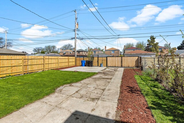 5068 W Congress Pkwy, Chicago, IL 60644 - view of yard featuring a patio area and driveway