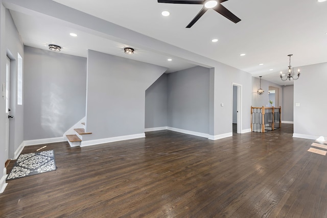 5068 W Congress Pkwy, Chicago, IL 60644 - unfurnished living room featuring a chandelier, dark wood-style flooring, baseboards, recessed lighting, and a ceiling fan