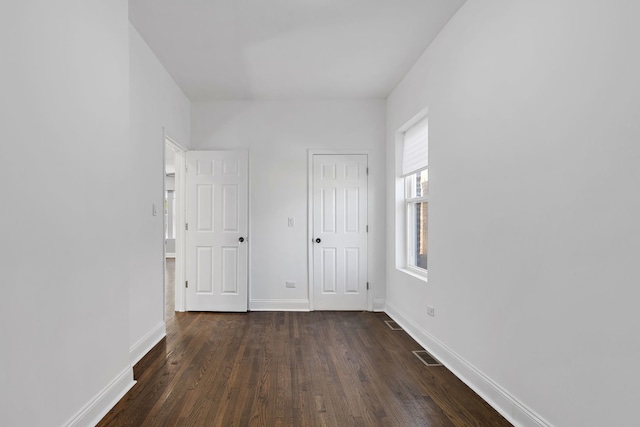 5068 W Congress Pkwy, Chicago, IL 60644 - unfurnished bedroom with dark wood-type flooring and baseboards