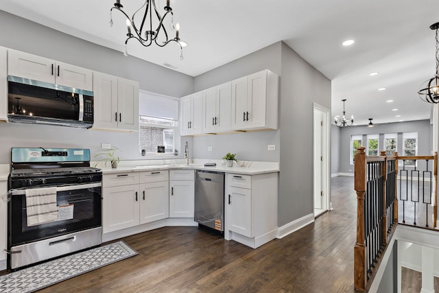 5068 W Congress Pkwy, Chicago, IL 60644 - kitchen with stainless steel appliances, a chandelier, white cabinets, light countertops, and recessed lighting