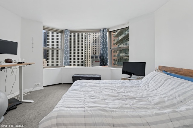 carpeted bedroom with baseboards