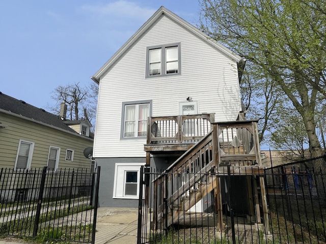 7340 S Maryland Ave, Chicago, IL 60619 - back of house with a fenced backyard, a deck, stairs, brick siding, and a gate