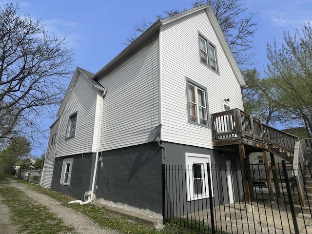 7340 S Maryland Ave, Chicago, IL 60619 - view of side of property with fence, a deck, and a gate