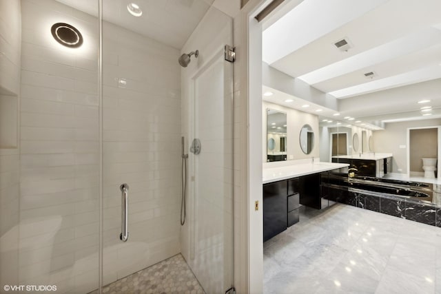 bathroom featuring vanity, a stall shower, recessed lighting, and visible vents