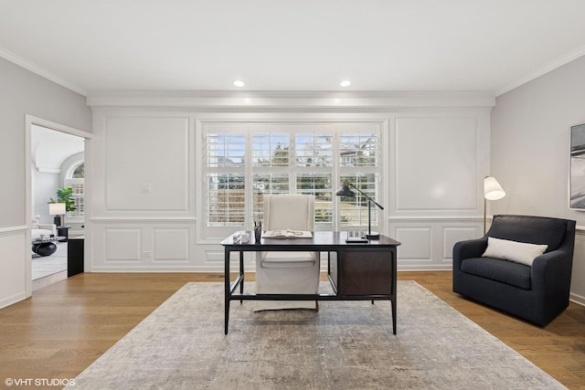 office area with crown molding and wood finished floors