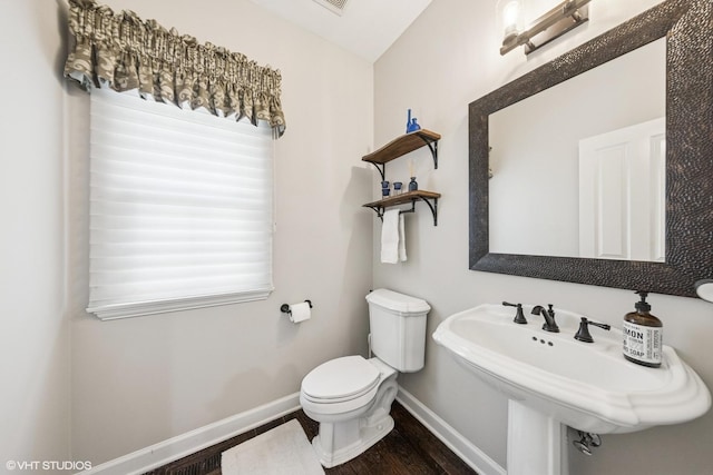 26W241 Arrow Glen Ct, Wheaton, IL 60189 - bathroom featuring wood finished floors, baseboards, toilet, and a sink