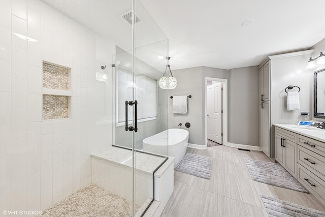 26W241 Arrow Glen Ct, Wheaton, IL 60189 - bathroom with a stall shower, a soaking tub, vanity, baseboards, and recessed lighting
