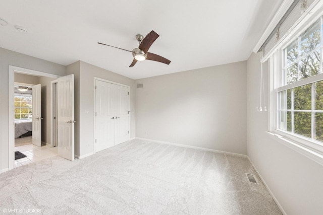 26W241 Arrow Glen Ct, Wheaton, IL 60189 - unfurnished bedroom with light carpet, baseboards, a closet, and ceiling fan