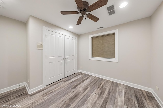 26W241 Arrow Glen Ct, Wheaton, IL 60189 - unfurnished bedroom featuring wood finished floors, baseboards, a closet, recessed lighting, and ceiling fan