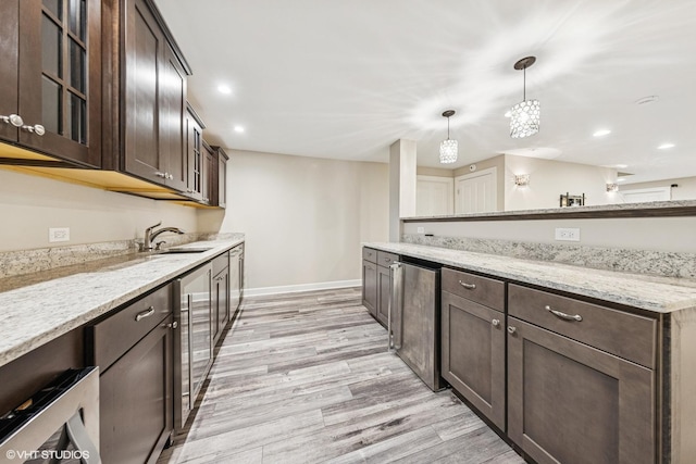 26W241 Arrow Glen Ct, Wheaton, IL 60189 - kitchen with a sink, dark brown cabinetry, beverage cooler, glass insert cabinets, and baseboards