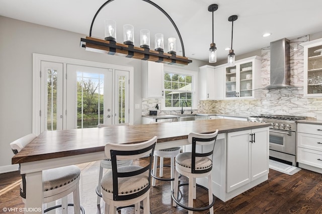 26W241 Arrow Glen Ct, Wheaton, IL 60189 - kitchen with stainless steel stove, wall chimney exhaust hood, wooden counters, decorative backsplash, and recessed lighting