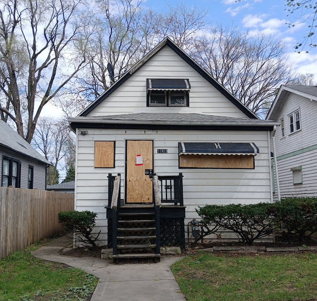 view of front of house with fence and entry steps
