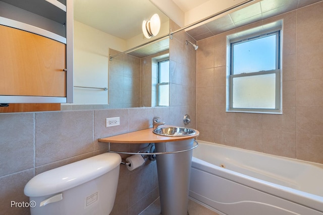 full bathroom featuring shower / bath combination, tile walls, and toilet