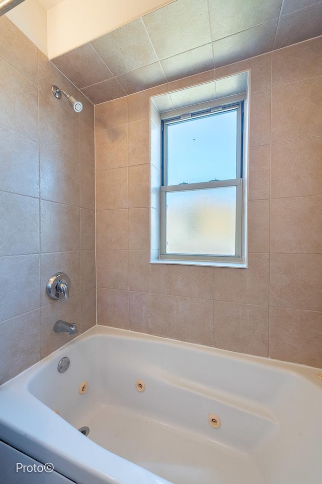 bathroom featuring a combined bath / shower with jetted tub