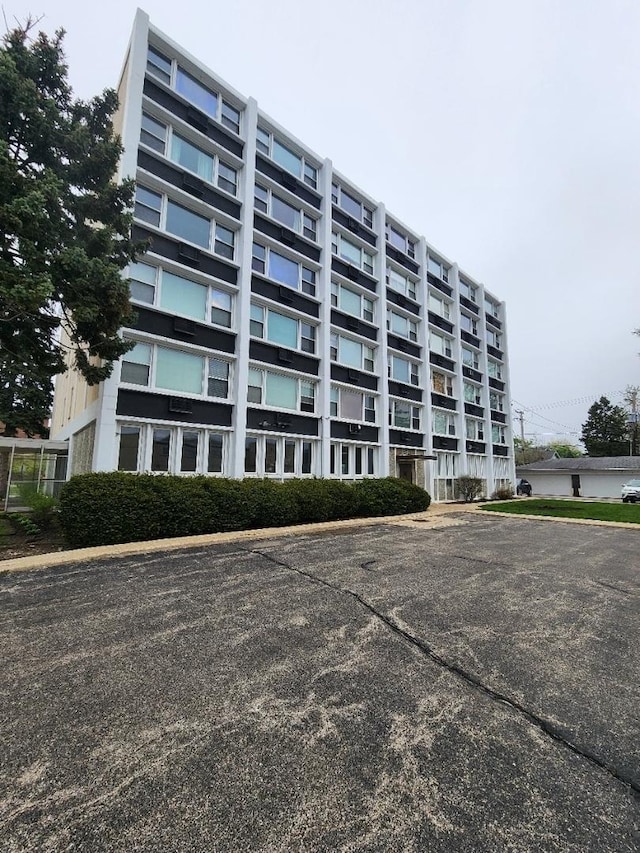 5975 N Odell Ave Unit 2C, Chicago, IL 60631 - living area with carpet and a ceiling fan