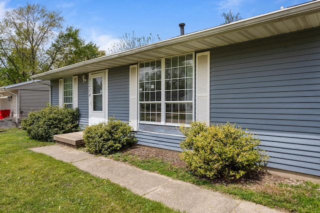 view of home's exterior featuring a lawn