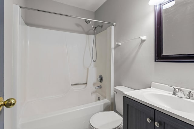 bathroom with toilet, shower / bathing tub combination, and vanity